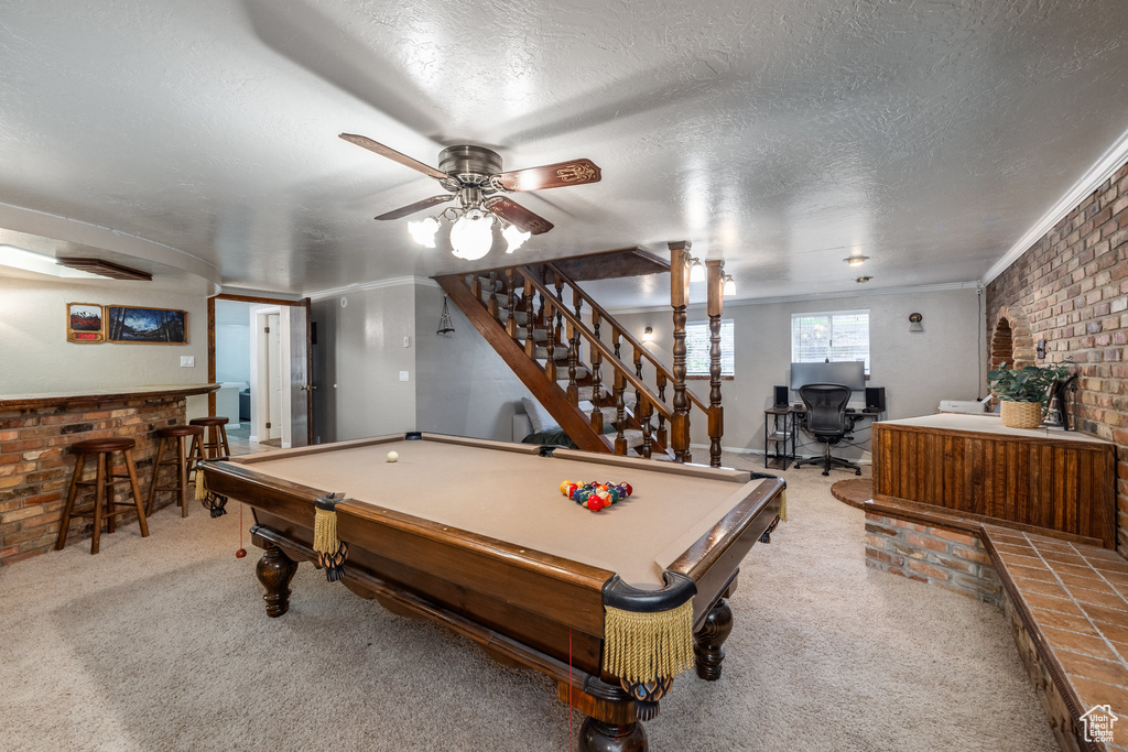 Playroom featuring brick wall, a bar, carpet flooring, billiards table, and ceiling fan