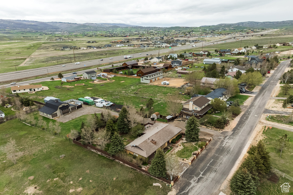 Aerial overview of property's location with a mountain backdrop