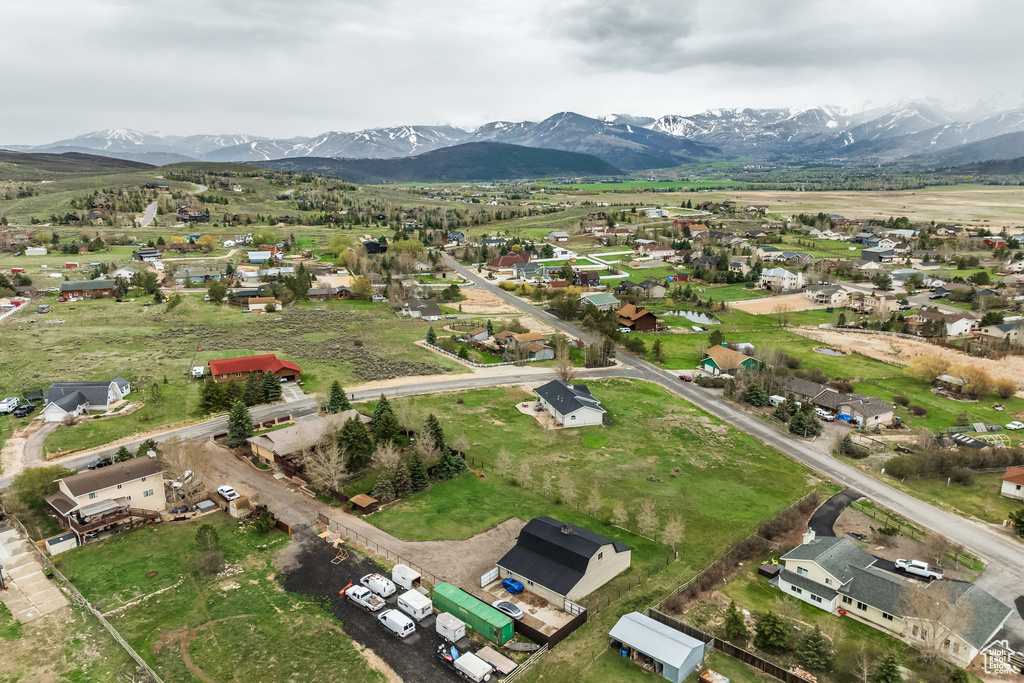 Aerial perspective of suburban area featuring a mountainous background