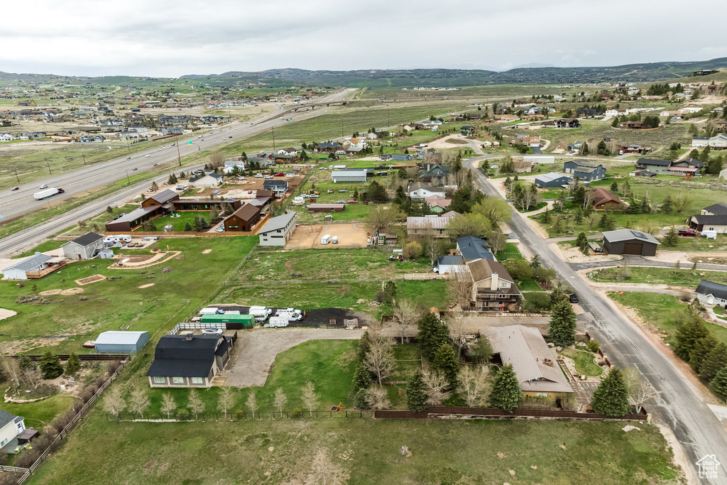 Aerial view of property's location with nearby suburban area