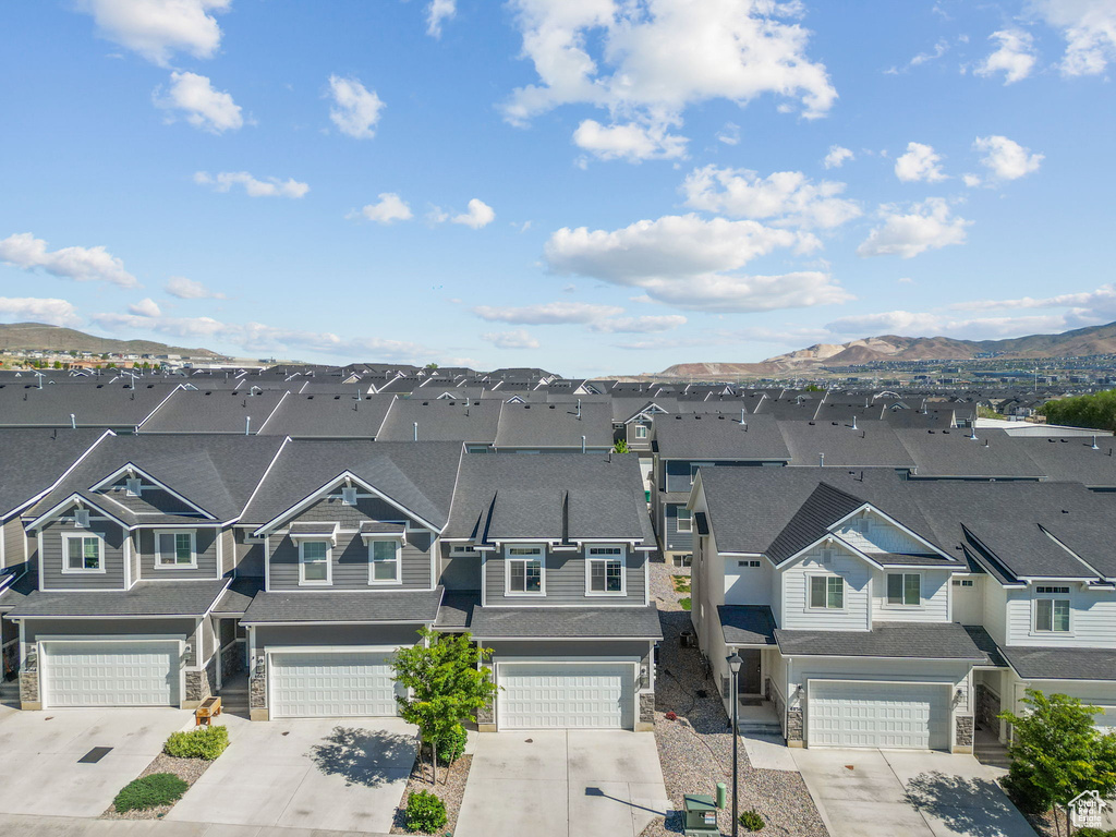 Aerial view of residential area with a mountainous background