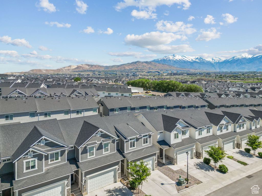 Aerial perspective of suburban area featuring a mountain backdrop