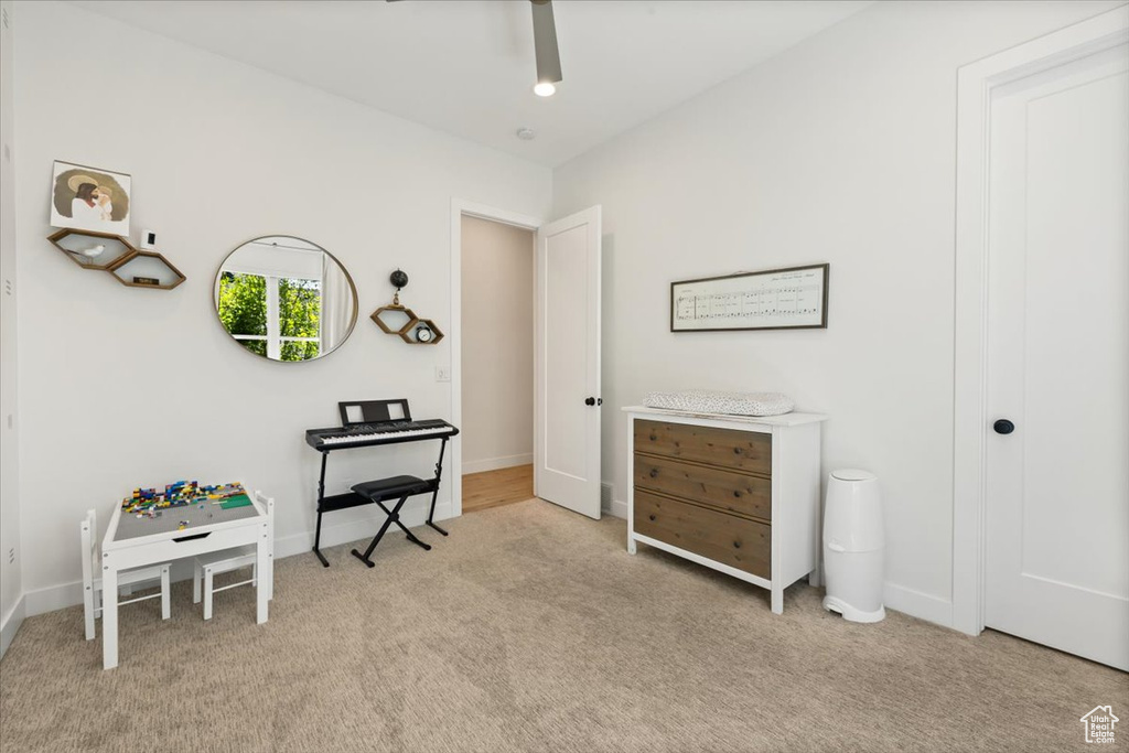 Bedroom featuring carpet floors and baseboards
