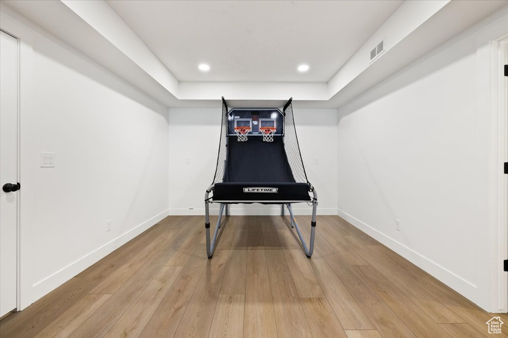 Playroom featuring light wood finished floors, baseboards, and recessed lighting