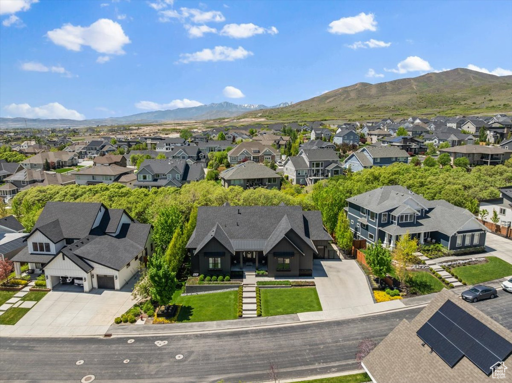 Aerial perspective of suburban area featuring a mountainous background