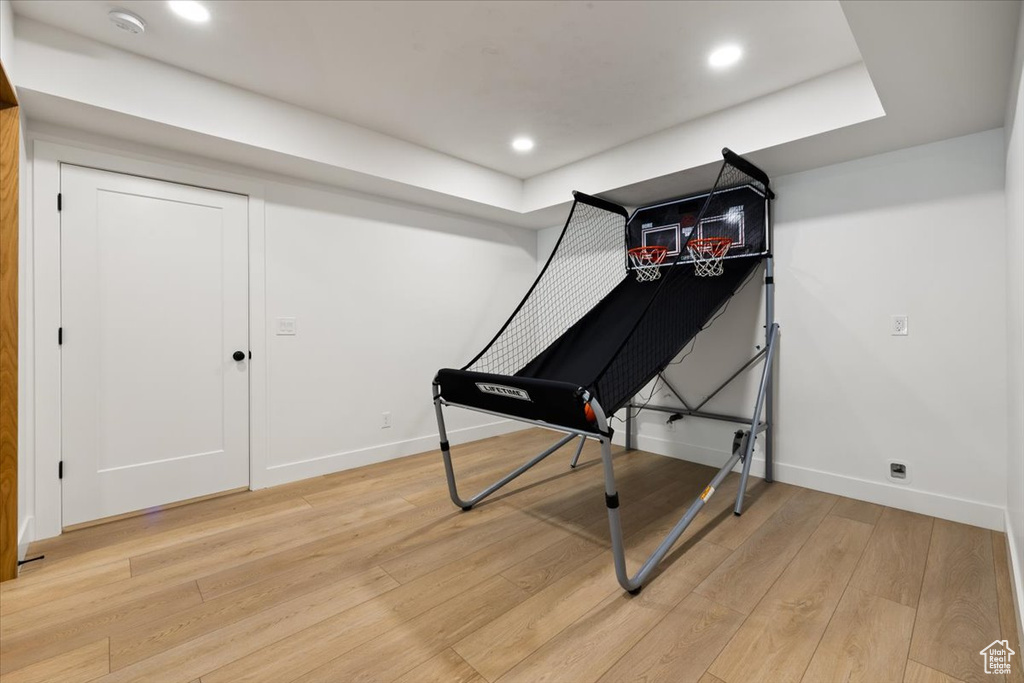 Game room featuring baseboards, light wood-style floors, and recessed lighting