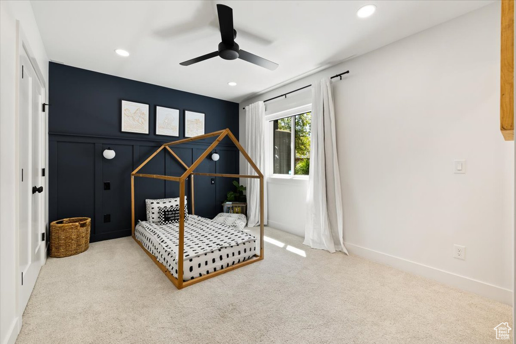 Carpeted bedroom featuring recessed lighting, a ceiling fan, and baseboards