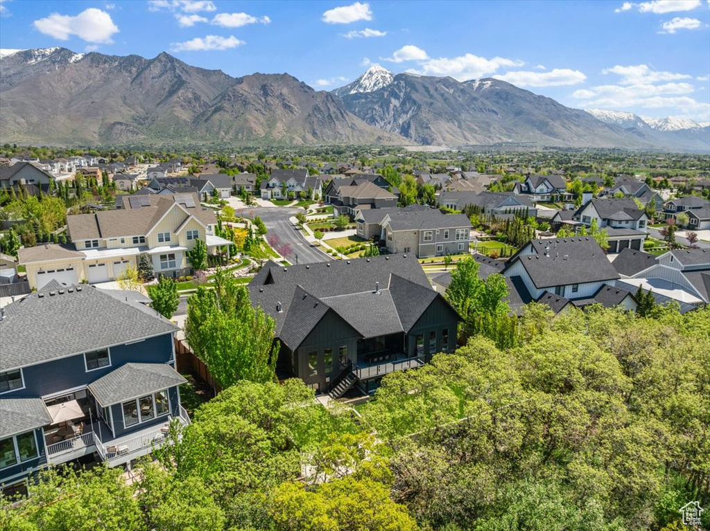 Aerial perspective of suburban area featuring a mountainous background