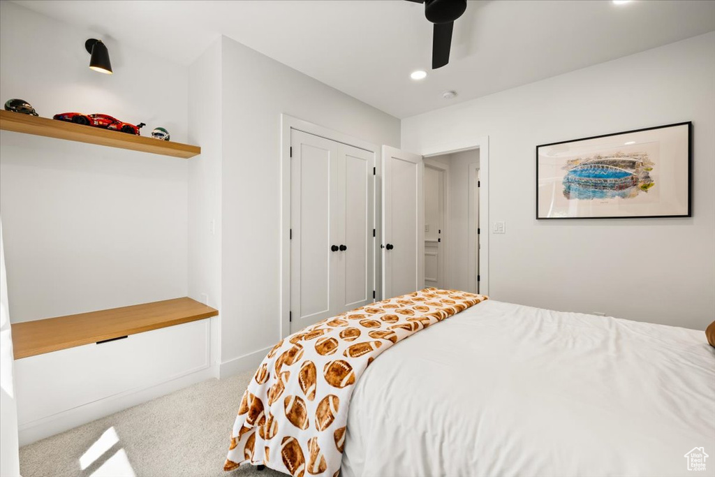 Bedroom featuring carpet flooring, recessed lighting, a ceiling fan, and a closet