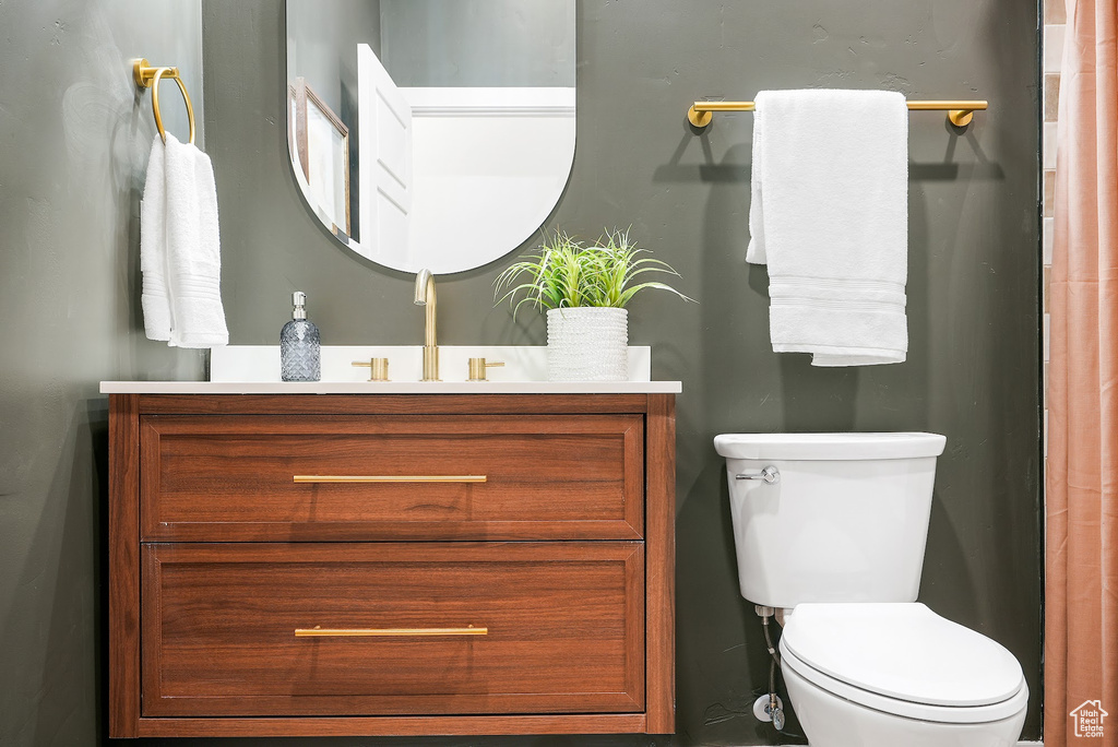 Bathroom featuring vanity and toilet