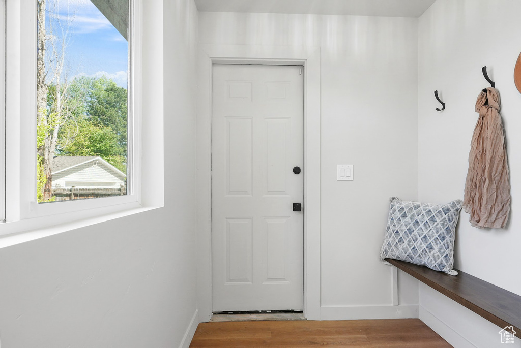 Mudroom featuring light wood-style floors and baseboards