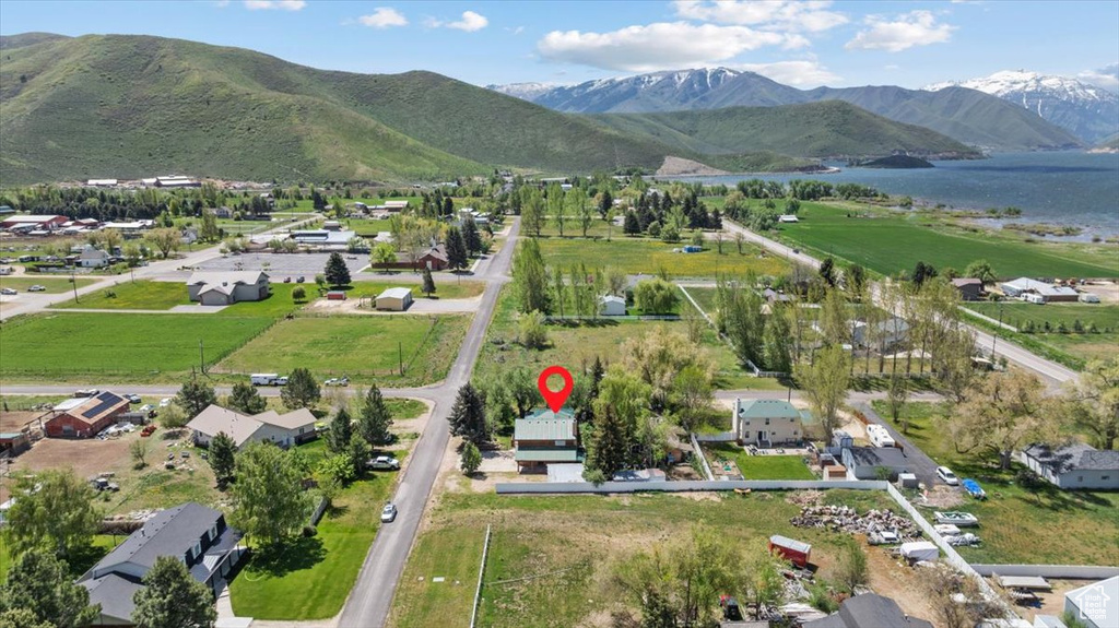 Aerial overview of property's location featuring a water and mountain view