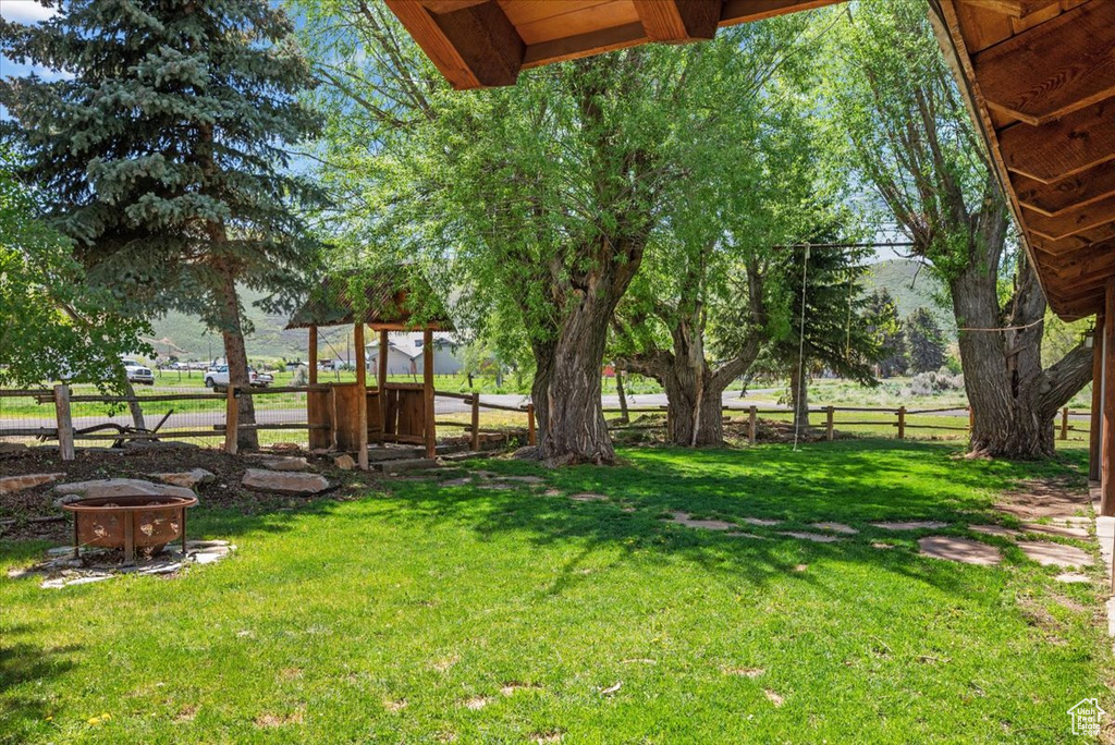 View of yard featuring a fire pit