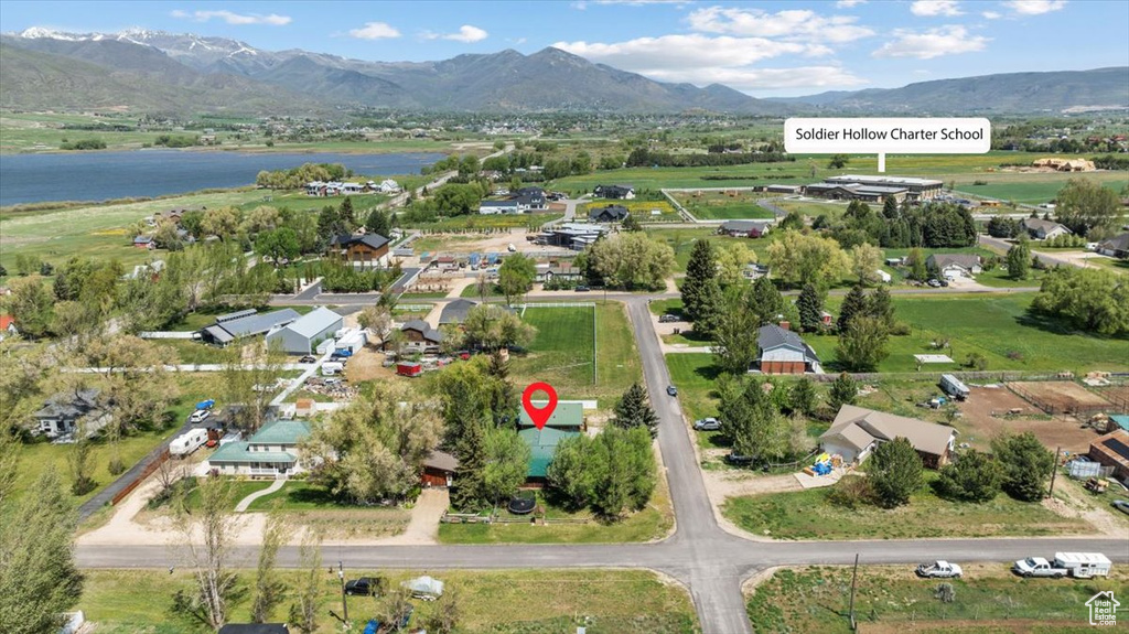 View of property location with a water and mountain view