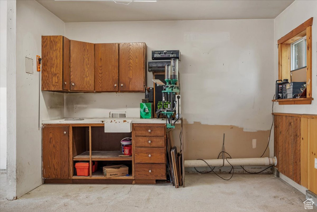 Kitchen with brown cabinets and light countertops