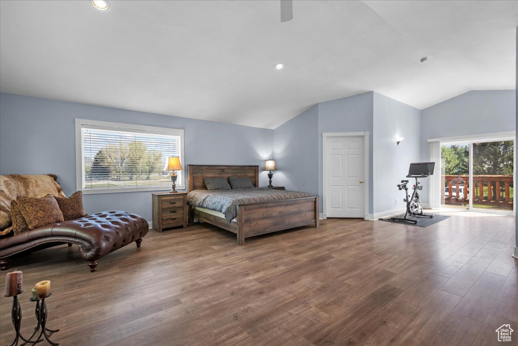 Bedroom with lofted ceiling, wood finished floors, access to outside, a ceiling fan, and baseboards