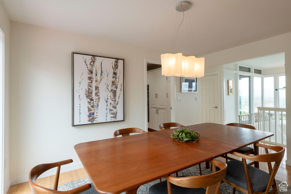 Dining area featuring wood finished floors and baseboards