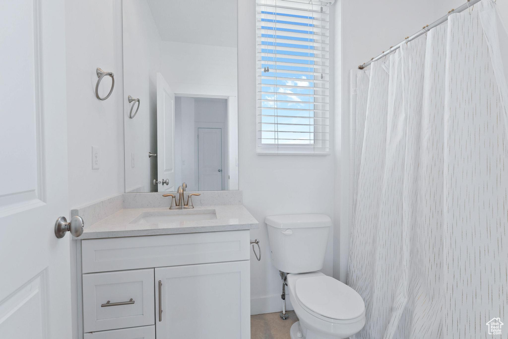 Bathroom featuring vanity and a shower with shower curtain