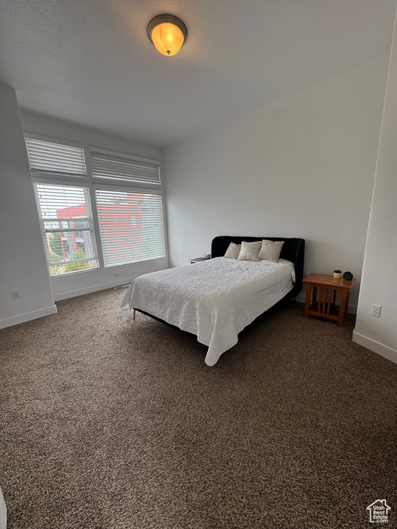 Bedroom with carpet and baseboards