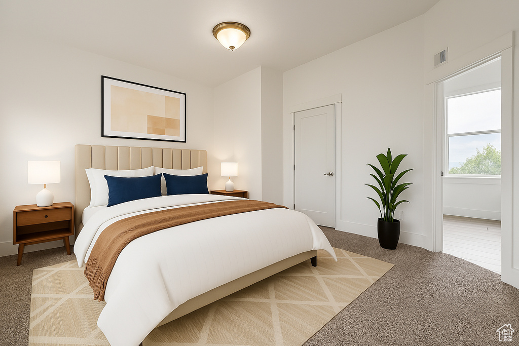 Carpeted bedroom featuring baseboards