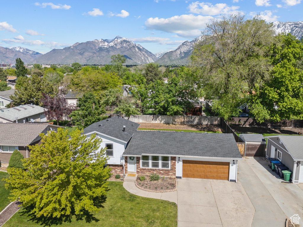 Aerial view of residential area featuring mountains