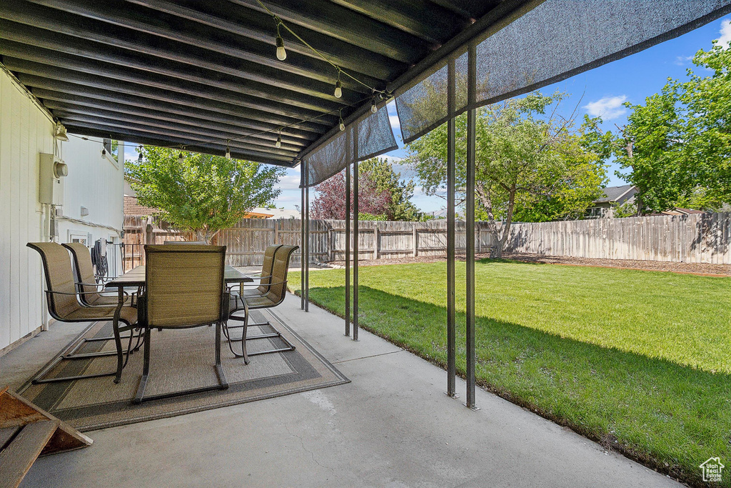 View of patio with outdoor dining area