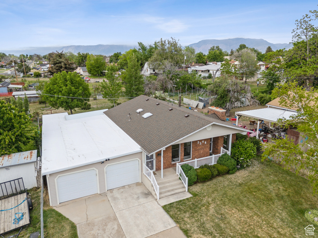 Aerial perspective of suburban area with a mountain backdrop