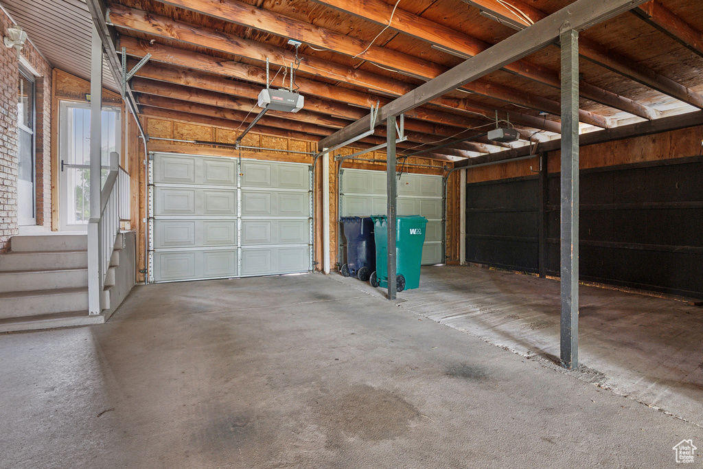 Garage featuring a garage door opener
