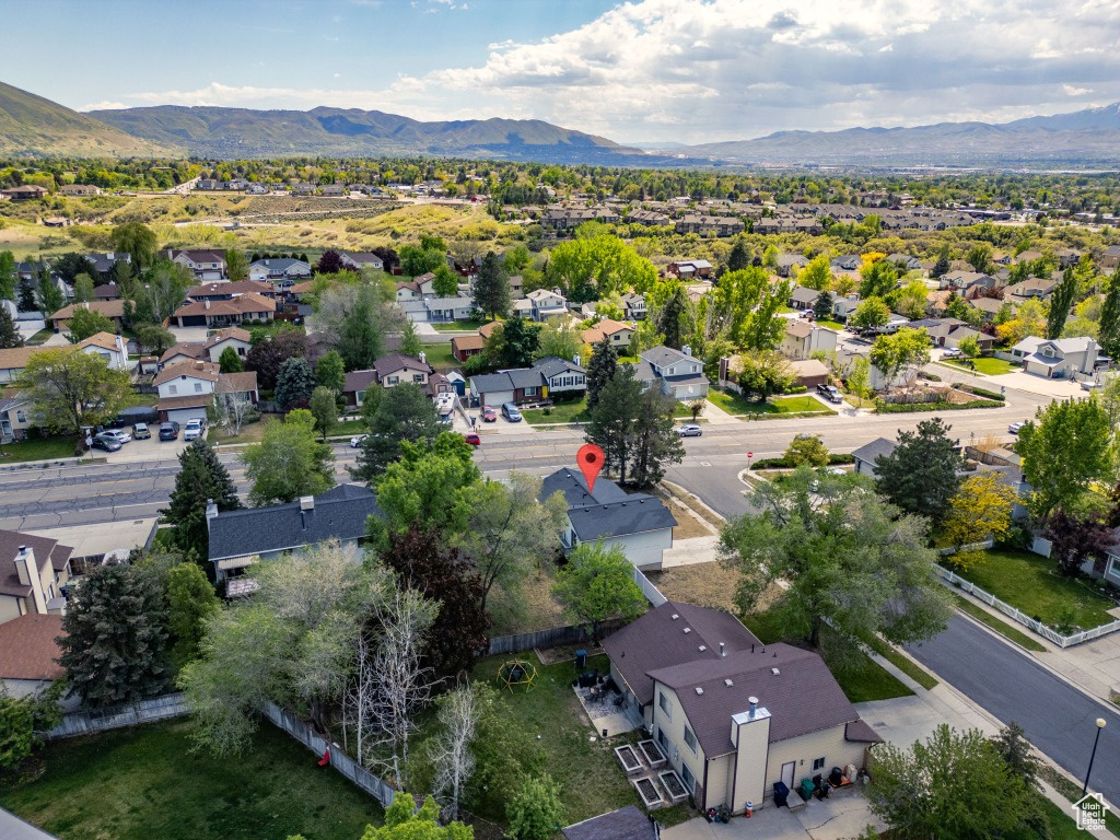 Aerial perspective of suburban area with a mountain backdrop