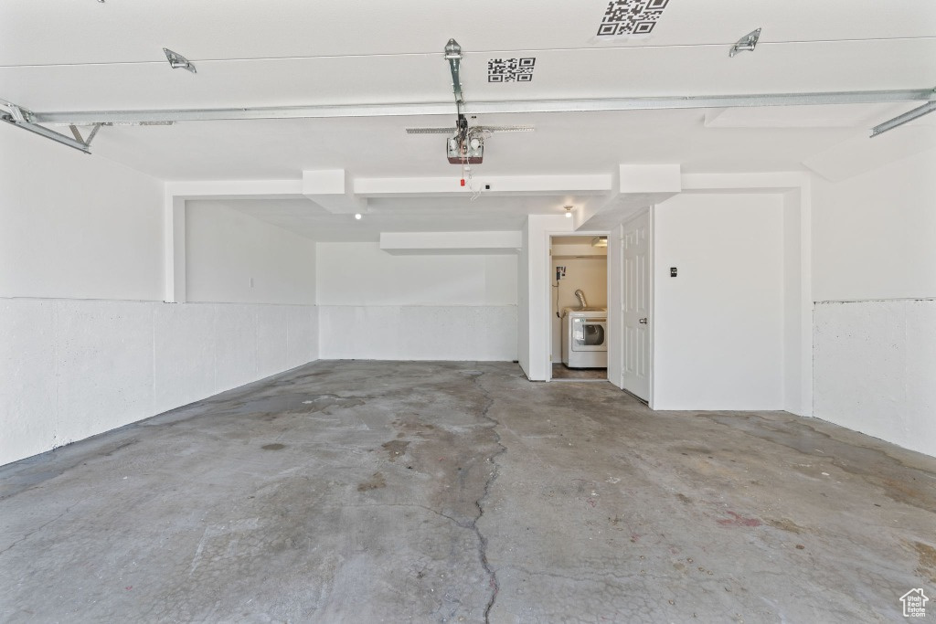 Garage with washer / dryer and a garage door opener