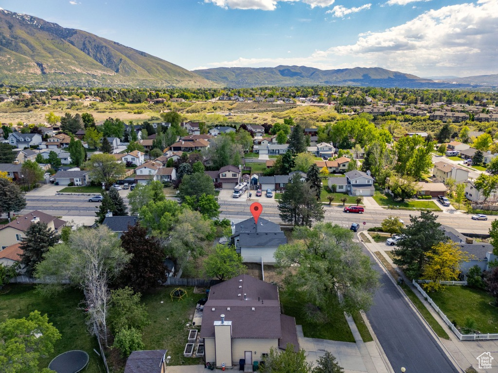 Aerial view of residential area featuring a mountainous background