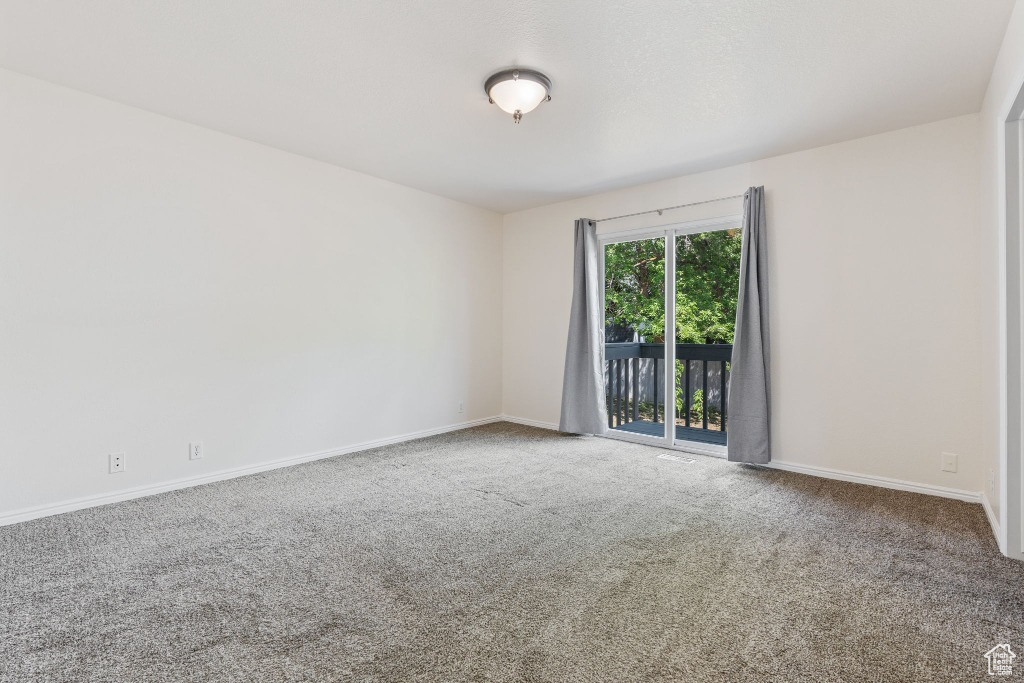 Spare room with carpet flooring and baseboards