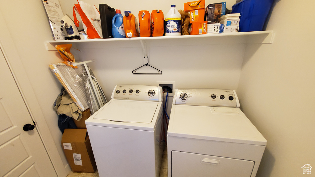 Washroom featuring washer and clothes dryer