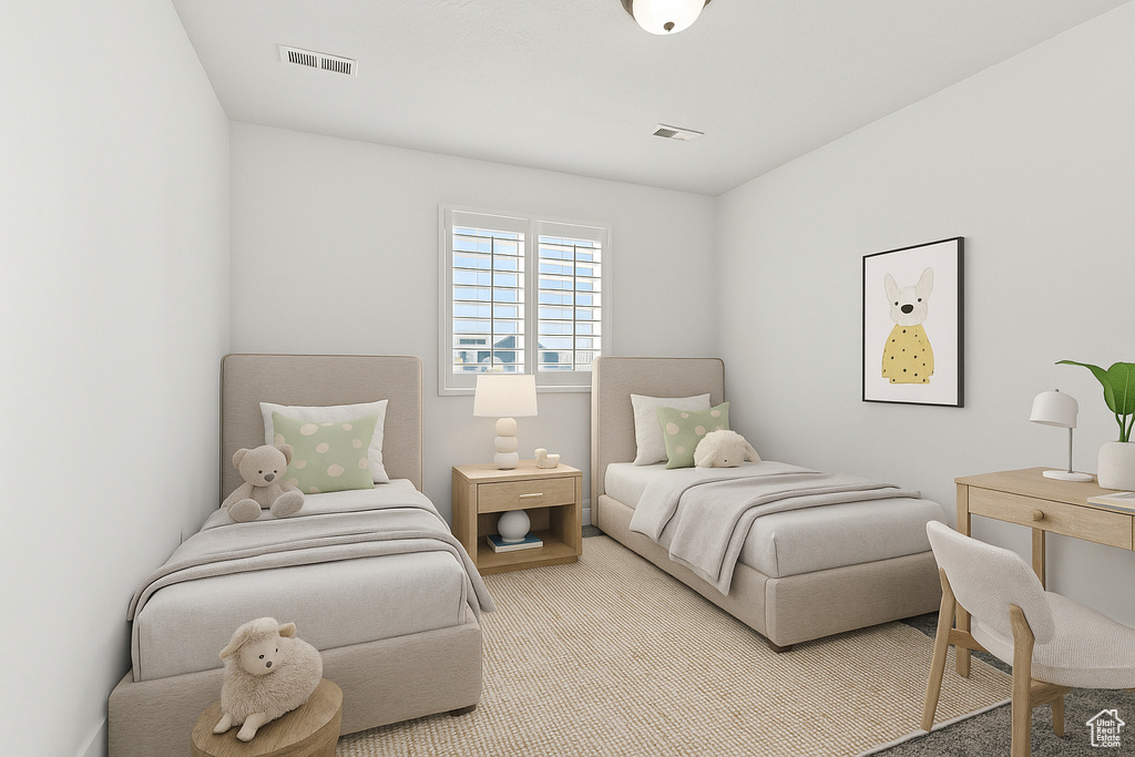 Bedroom with light colored carpet