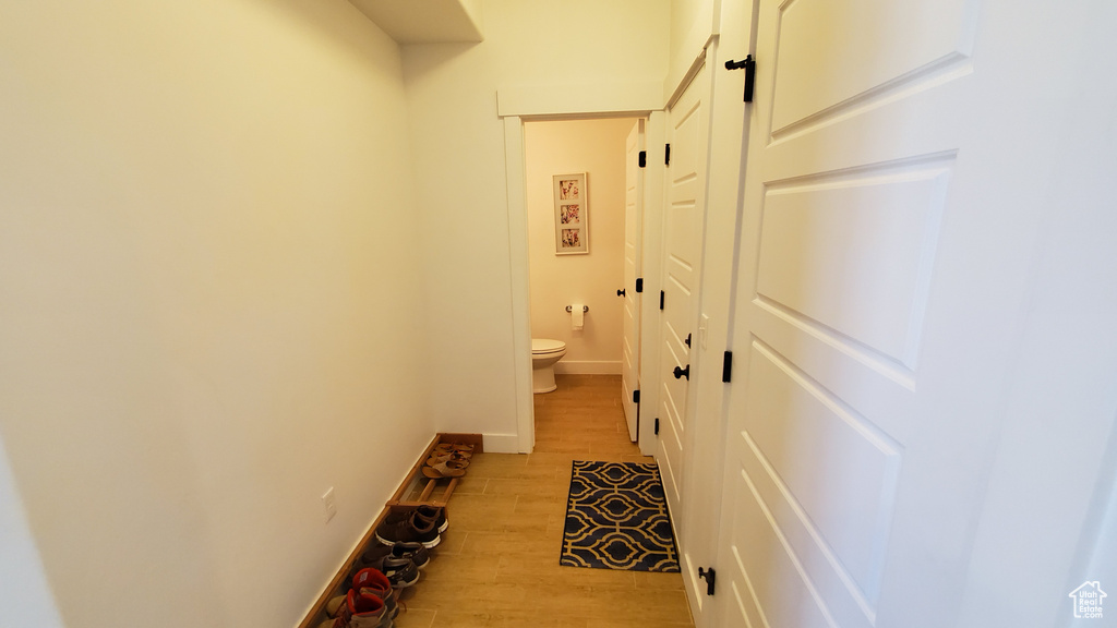 Corridor with light wood finished floors