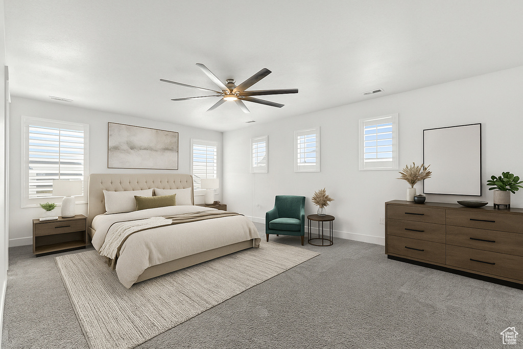 Bedroom featuring light carpet and ceiling fan