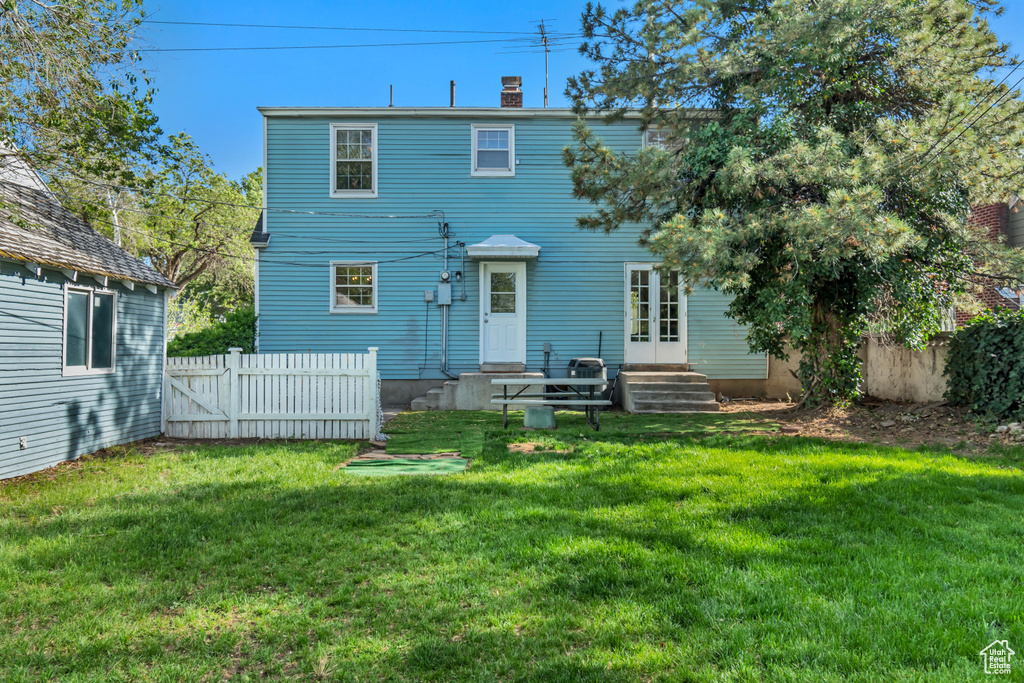 Rear view of house with a chimney