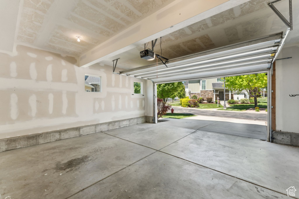 Garage featuring a garage door opener
