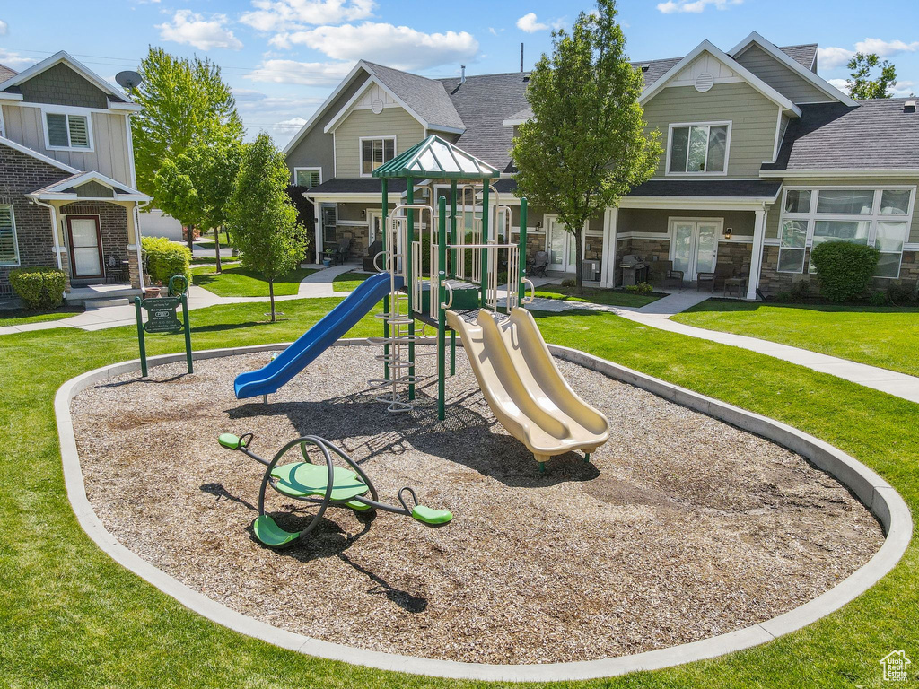 View of play area featuring a yard and french doors