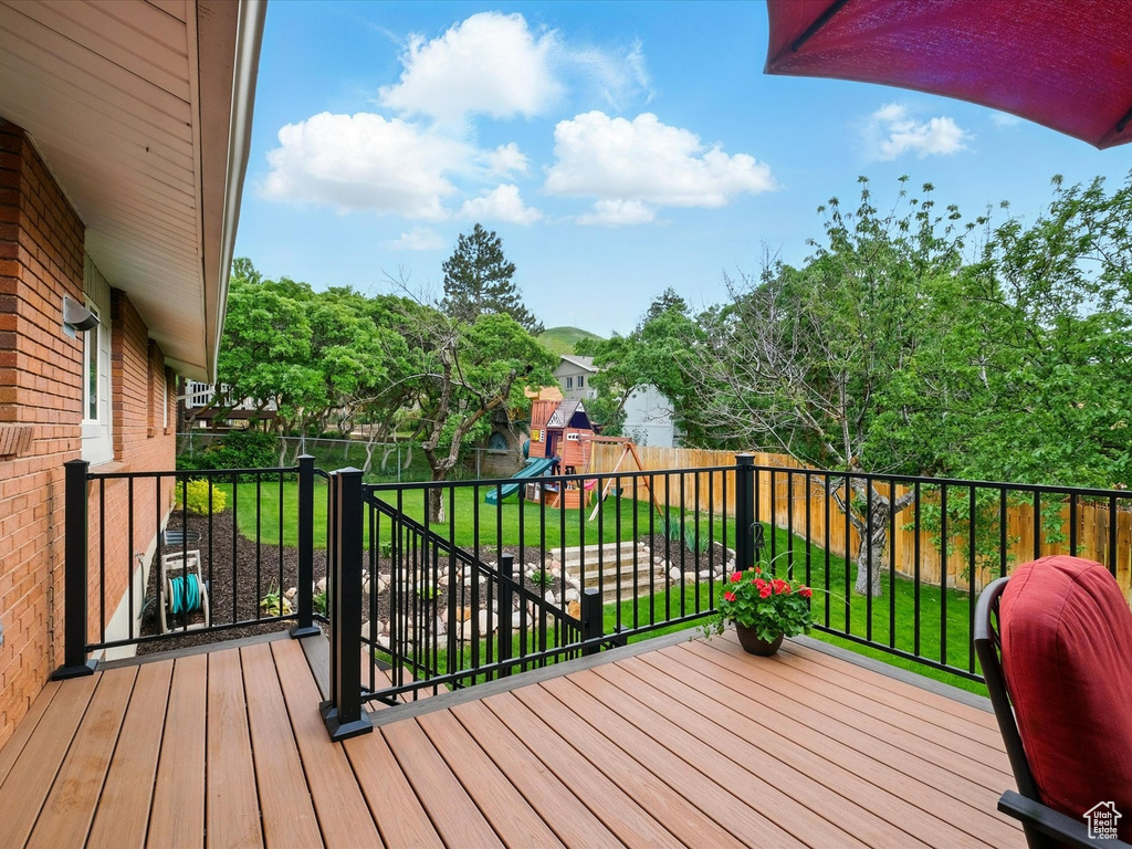 Wooden deck with a playground