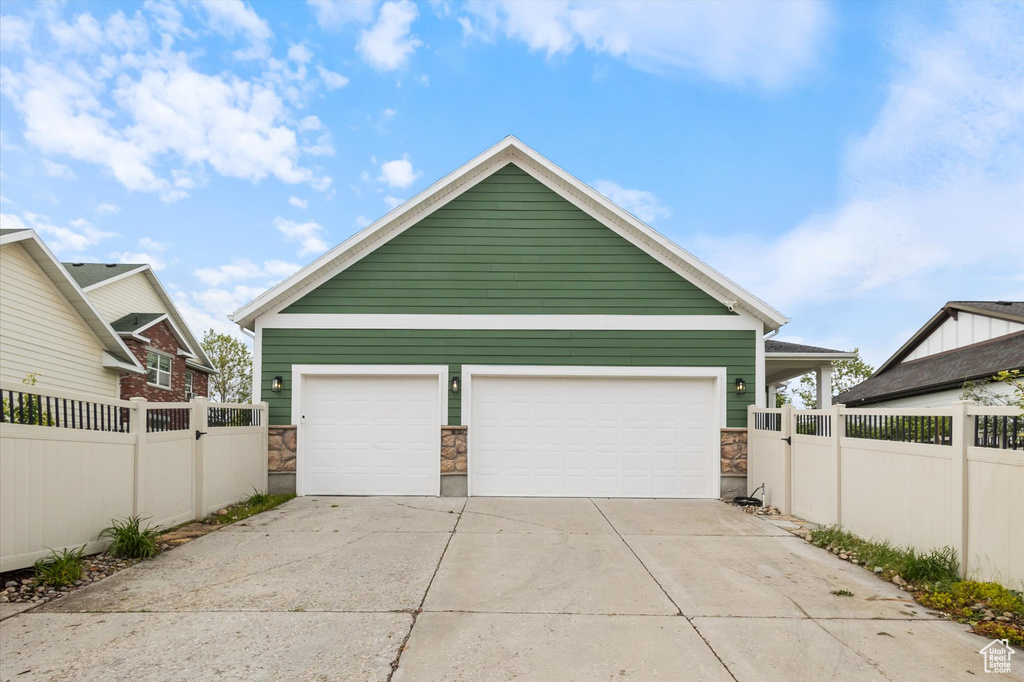 Garage featuring fence