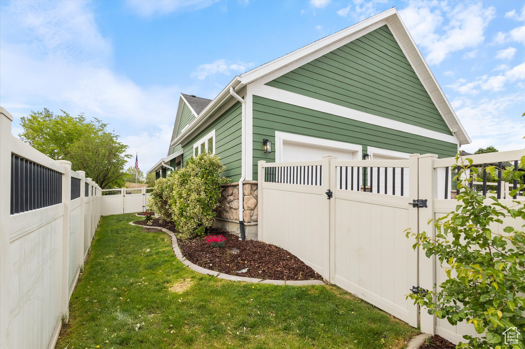 View of property exterior with a gate