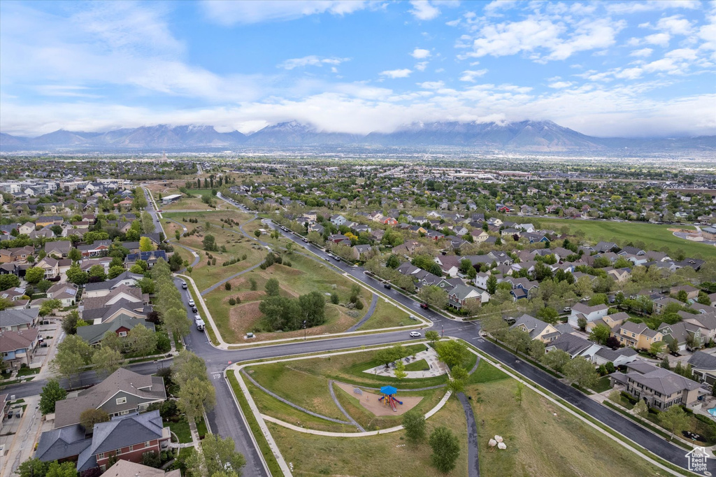 Aerial view of property's location featuring mountains and nearby suburban area