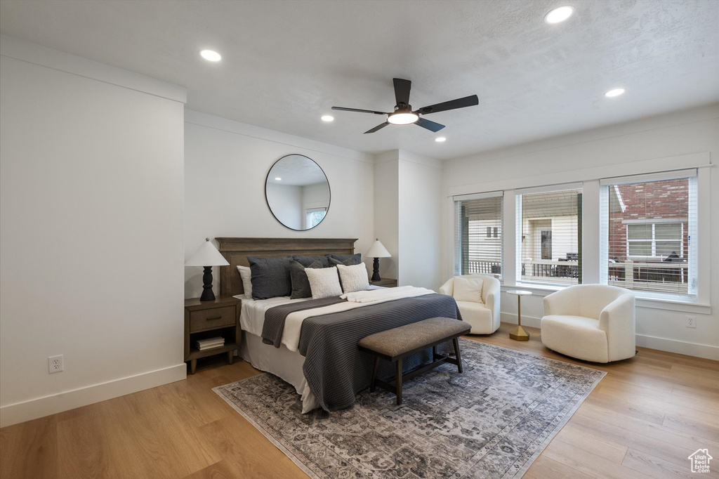 Bedroom featuring recessed lighting, baseboards, light wood-type flooring, and ceiling fan