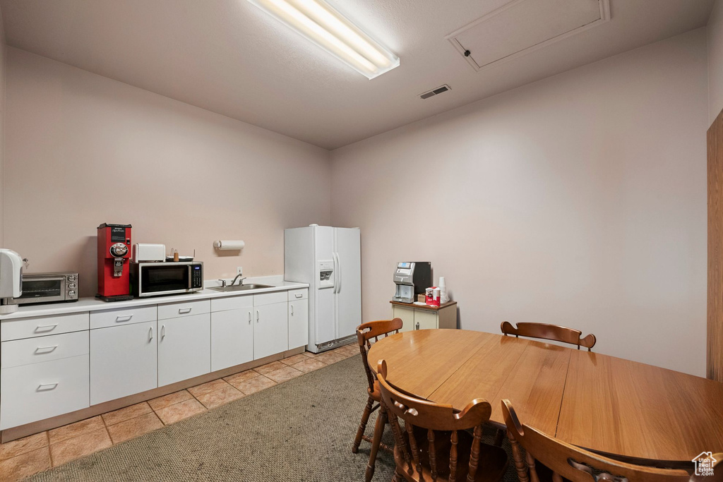 Dining room with light tile patterned floors