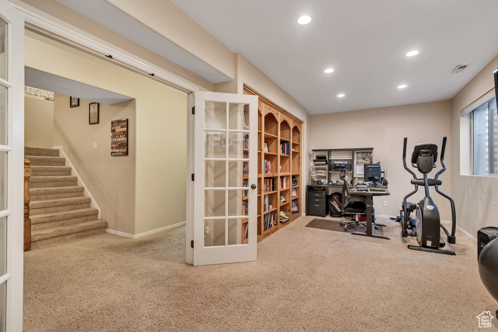 Exercise room featuring carpet floors, recessed lighting, baseboards, and french doors