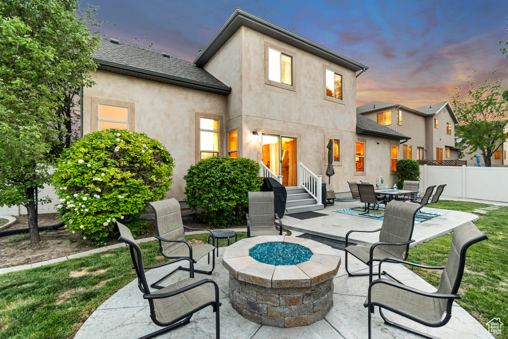 View of patio / terrace with an outdoor fire pit and entry steps