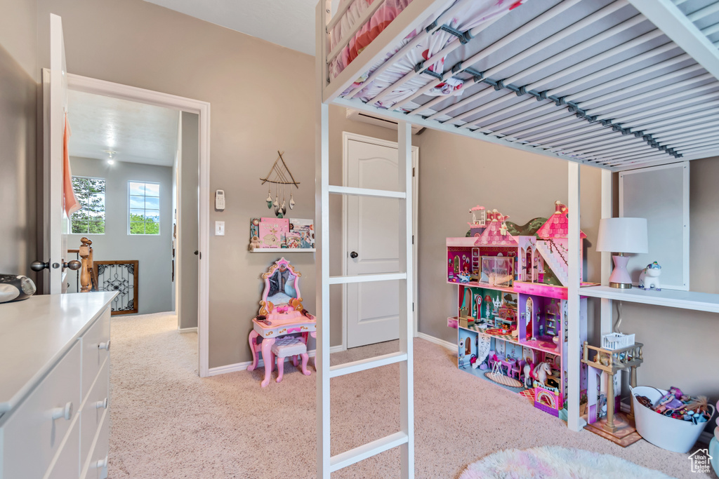 Bedroom with carpet floors and baseboards