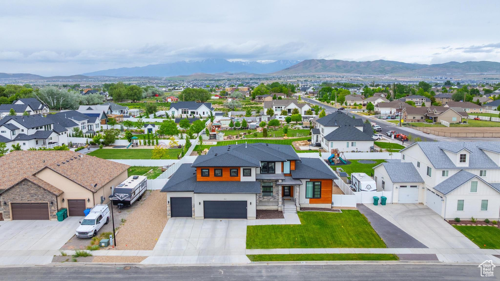 Aerial perspective of suburban area featuring a mountainous background