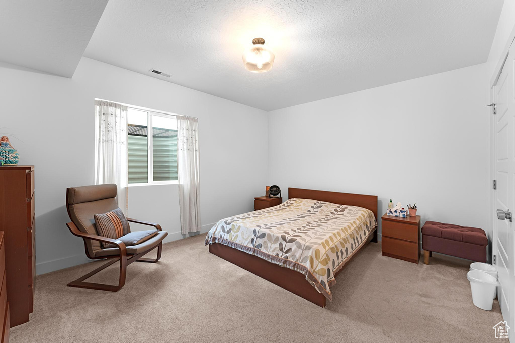 Carpeted bedroom with baseboards